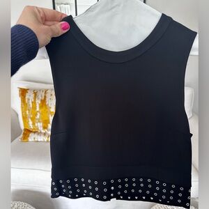 ALC “cropped” top size 4. Silver design details at the bottom. Zipper closing.